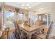 Formal dining room featuring large windows, an ornate dining set, and elegant decor throughout at 1249 Maddy Ln, Rock Hill, SC 29732