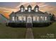 Charming two-story home with a welcoming front porch and manicured landscaping at 1249 Maddy Ln, Rock Hill, SC 29732