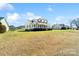 Wide shot of a two-story home with a large lawn and inviting front porch, set on a spacious lot at 1249 Maddy Ln, Rock Hill, SC 29732