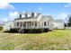 Side view of a lovely two-story home with a manicured lawn, front porch, and detached garage at 1249 Maddy Ln, Rock Hill, SC 29732