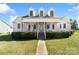 Charming two-story home featuring a large front porch, dormer windows, and a well-manicured lawn at 1249 Maddy Ln, Rock Hill, SC 29732