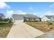 Exterior view of home with a well-kept lawn, driveway, and attached two-car garage at 1249 Maddy Ln, Rock Hill, SC 29732