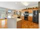 Bright, modern kitchen with stainless steel appliances, granite countertops, and hardwood floors at 1249 Maddy Ln, Rock Hill, SC 29732