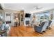 Inviting living room features hardwood floors, a fireplace with a TV, and large windows at 1249 Maddy Ln, Rock Hill, SC 29732