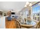 Elegant dining area and living room with hardwood floors, large windows, and a cozy fireplace at 1249 Maddy Ln, Rock Hill, SC 29732