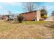 Backyard view of the home featuring a garage and spacious outdoor area at 1285 Riverview Dr, Hickory, NC 28602