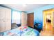 Bright bedroom featuring blue walls, playful ' decor, and natural light enhancing the cheerful ambiance at 1285 Riverview Dr, Hickory, NC 28602