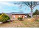 Lovely brick home featuring well-manicured front yard with mature trees and an inviting entrance at 1285 Riverview Dr, Hickory, NC 28602