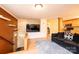 Open-concept living room with a cozy couch, TV, and easy access to the kitchen area at 1285 Riverview Dr, Hickory, NC 28602
