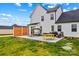 The backyard features a concrete patio with outdoor seating, a grill and a wooden privacy fence at 135 Goldenrod Cir, Salisbury, NC 28147