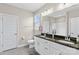 Bathroom features a double vanity with granite countertop, a large mirror, and a separate toilet room at 135 Goldenrod Cir, Salisbury, NC 28147