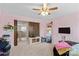 Pink bedroom with TV, barn doors to walk-in closet, carpeted floor and neutral trim at 135 Goldenrod Cir, Salisbury, NC 28147