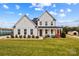 Exterior view of a two-story home with covered front porch and manicured lawn at 135 Goldenrod Cir, Salisbury, NC 28147