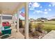 Covered front porch with sitting area and landscaping showcasing curb appeal at 135 Goldenrod Cir, Salisbury, NC 28147