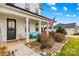 Charming front porch with a sitting area and view of the landscaped front yard at 135 Goldenrod Cir, Salisbury, NC 28147