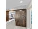 Hallway with barn doors leading to a bedroom with pink walls and carpeted floors at 135 Goldenrod Cir, Salisbury, NC 28147