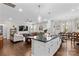 The open-concept kitchen seamlessly blends into the living room and dining area for easy entertaining at 135 Goldenrod Cir, Salisbury, NC 28147