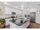 Modern kitchen featuring stainless steel appliances, granite countertops, and a stylish center island at 135 Goldenrod Cir, Salisbury, NC 28147