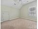 Bright bedroom with large window and neutral carpet at 1394 Fitzgerald Nw St, Concord, NC 28027