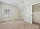Bedroom with closet, window, and neutral carpet at 1394 Fitzgerald Nw St, Concord, NC 28027