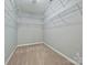 Walk-in closet with carpet and extensive wire shelving for optimal organization at 1394 Fitzgerald Nw St, Concord, NC 28027