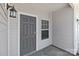 The home's front entry features a craftsman-style front door, with a window to the right side of the door at 140 S Bell Ave, Albemarle, NC 28001