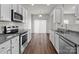 Well-equipped kitchen featuring stainless steel appliances and plenty of countertop space at 140 S Bell Ave, Albemarle, NC 28001