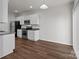 Kitchen featuring stainless steel appliances, bright cabinets, and plenty of countertop space at 140 S Bell Ave, Albemarle, NC 28001