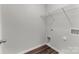 Finished laundry room with wire shelving and luxury vinyl plank flooring at 140 S Bell Ave, Albemarle, NC 28001