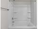 Modern, newly remodeled shower-tub combo with built in shelving and brushed nickel hardware at 142 S Bell Ave, Albemarle, NC 28001