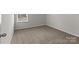Bedroom with neutral walls and carpet, a window and plenty of space at 142 S Bell Ave, Albemarle, NC 28001