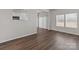 Dining room with hardwood floors, modern light fixture, and a sliding door to the outside at 142 S Bell Ave, Albemarle, NC 28001