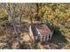 An aerial view of a brick house and its yard surrounded by trees at 14725 N Old Statesville Rd, Huntersville, NC 28078