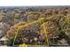Breathtaking aerial view of a beautiful lot surrounded by a canopy of colorful fall trees and natural landscape at 14725 N Old Statesville Rd, Huntersville, NC 28078