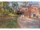 A view of the back of a brick house and the back yard at 14725 N Old Statesville Rd, Huntersville, NC 28078