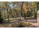 Expansive back yard with mature trees and foliage and a view of the side of the house at 14725 N Old Statesville Rd, Huntersville, NC 28078