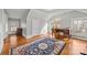 Bedroom with sloped ceiling and wood floors offers natural light and desk area at 14725 N Old Statesville Rd, Huntersville, NC 28078