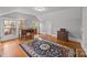 Bedroom with sloped ceiling and wood floors offers natural light and desk area at 14725 N Old Statesville Rd, Huntersville, NC 28078