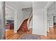 Light-filled foyer with hardwood floors and staircase at 14725 N Old Statesville Rd, Huntersville, NC 28078