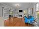 Bright living room with fireplace, barn door and hardwood floors at 14725 N Old Statesville Rd, Huntersville, NC 28078