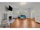 Bright living room with fireplace, hardwood floors and bright decor at 14725 N Old Statesville Rd, Huntersville, NC 28078