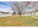 Large back yard features a screened porch and ample space, framed by fencing and mature trees at 15707 Southern Garden Ln, Charlotte, NC 28278