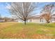 Expansive back yard offering a serene setting, featuring a screened porch, solar panels, and ample green space at 15707 Southern Garden Ln, Charlotte, NC 28278