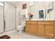 Bathroom featuring a glass-enclosed shower, toilet, and vanity with storage at 15707 Southern Garden Ln, Charlotte, NC 28278
