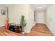 Welcoming entryway featuring hardwood flooring and a convenient coat closet at 15707 Southern Garden Ln, Charlotte, NC 28278