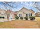 Charming home featuring well-manicured landscaping, a two-car garage, and a welcoming front entrance at 15707 Southern Garden Ln, Charlotte, NC 28278