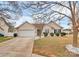 Inviting single-story home featuring a two-car garage and a well-maintained lawn at 15707 Southern Garden Ln, Charlotte, NC 28278