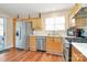Well-equipped kitchen featuring a stainless steel refrigerator and modern appliances at 15707 Southern Garden Ln, Charlotte, NC 28278