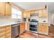 Functional kitchen featuring stainless steel appliances and light wood cabinetry at 15707 Southern Garden Ln, Charlotte, NC 28278