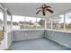 Inviting screened porch with ceiling fan and picturesque backyard view, perfect for relaxing and entertaining at 15707 Southern Garden Ln, Charlotte, NC 28278